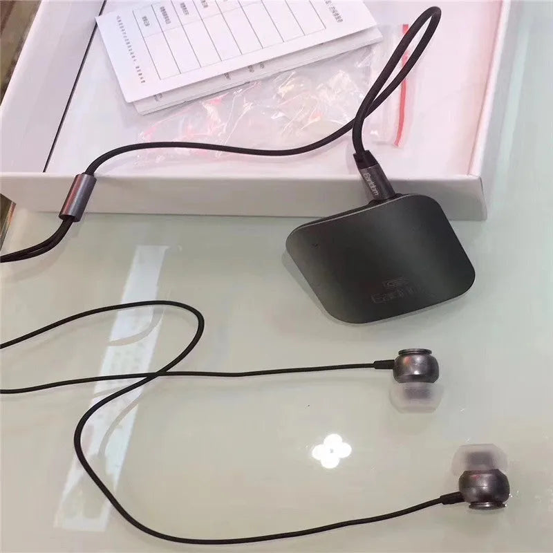 Black Bluetooth audio receiver headphones with lavalier clip for running and hands-free calling