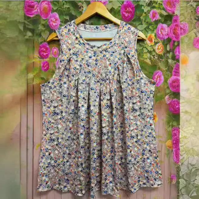 Black plus-size sleeveless vest with floral print, round neck, and loose fit on a hanger.