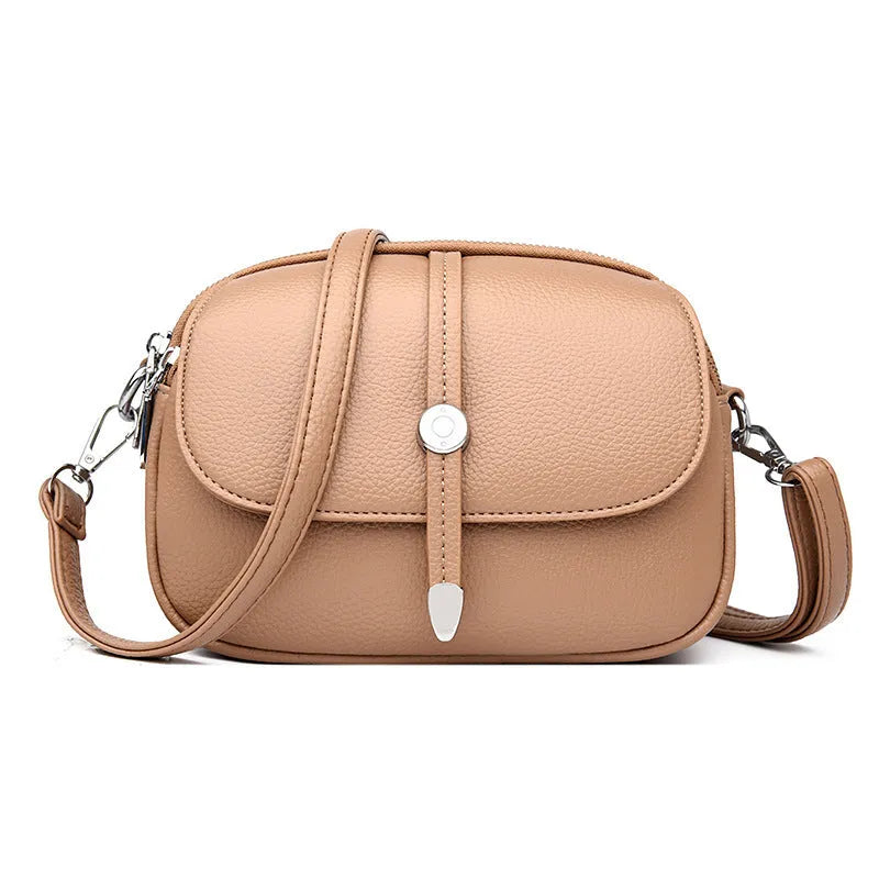 City Simple women's crossbody shoulder bag in soft PU leather with oval suitcase shape and sewing thread detailing