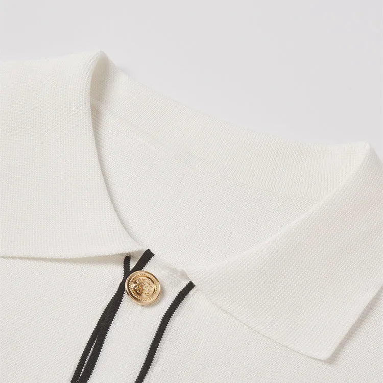 White women's cardigan with contrasting colour lapels and short sleeves.