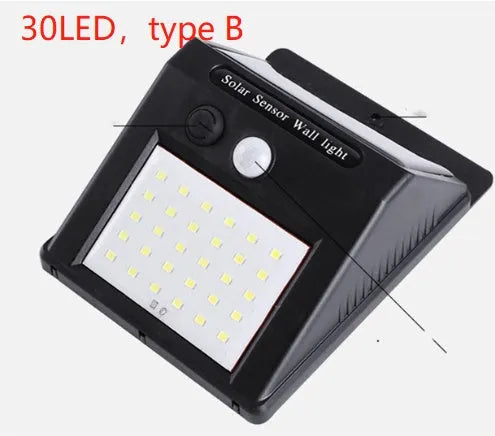 Solar-powered outdoor garden lamp with LED lights and integrated solar panel on a stake.