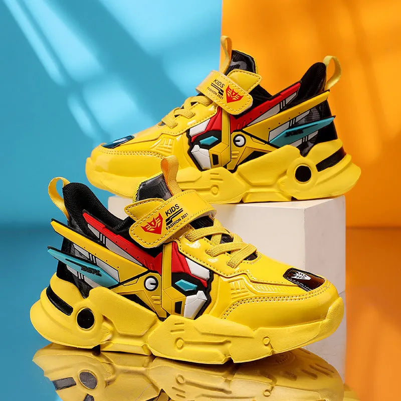 Boys yellow artificial leather sneakers with Velcro strap and cartoon pattern, on a rubber sole.