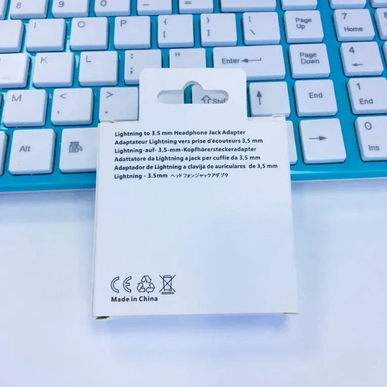 White Lightning to 3.5mm audio adapter for iPhone 7 6 6S models with gold-plated connector