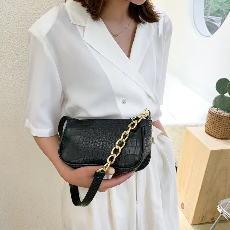 Retro women's shoulder baguette bag in PU leather with car suture detail and zipper closure