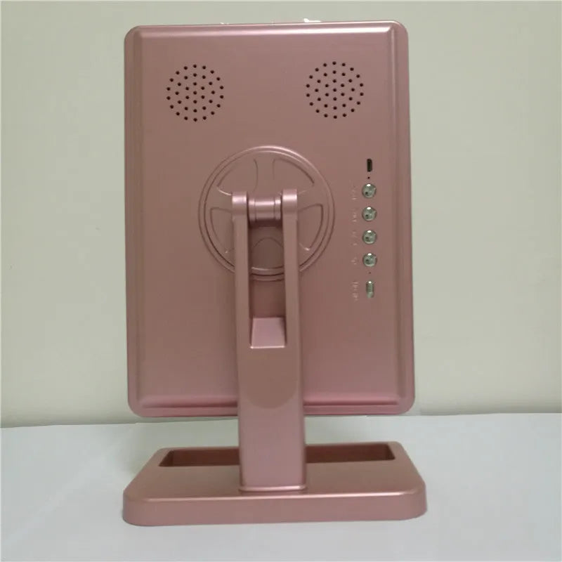 Pink touch screen makeup mirror with ring of 20 LED lights and Bluetooth speaker.