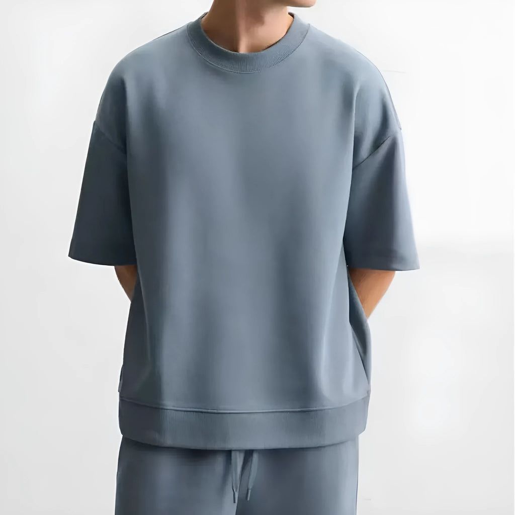 Loose double-sided cloth texture short sleeve shirt and matching shorts in blue, laid flat.