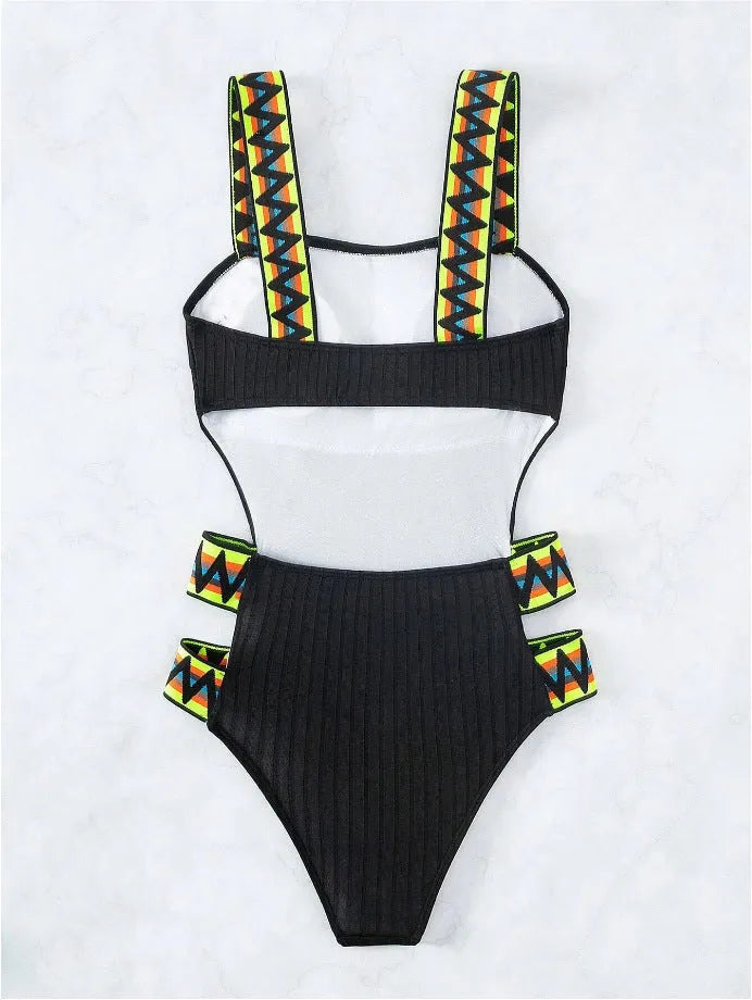 Women's solid colour one-piece swimsuit in black or orange on a mannequin