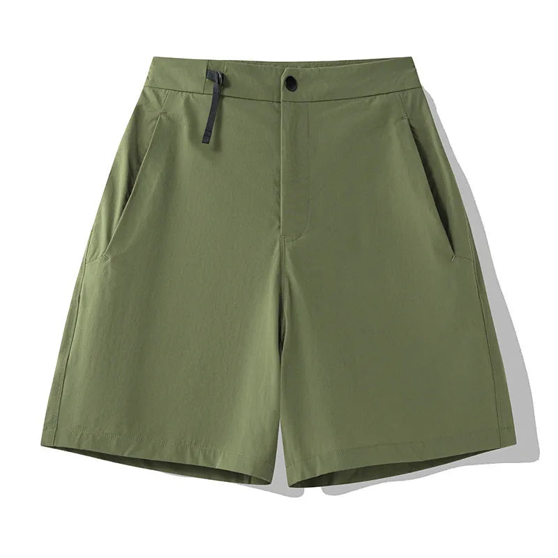Man wearing army green quick-dry sports shorts with an elastic waistband for running or climbing.