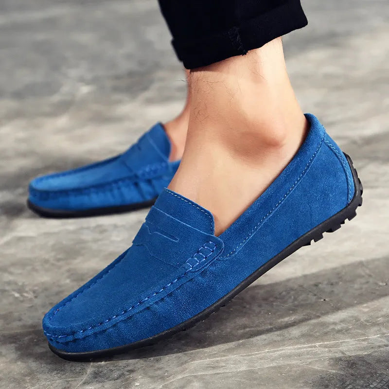Men's suede leather Gommino-style slip-on casual shoes in brown, shown from the side.