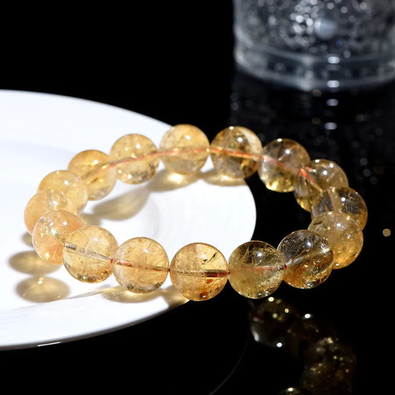 Natural yellow citrine bracelet with spherical beads in Brazilian yellow and violent yellow colour options