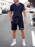Men's blue printed short sleeve top and matching shorts sports set laid flat