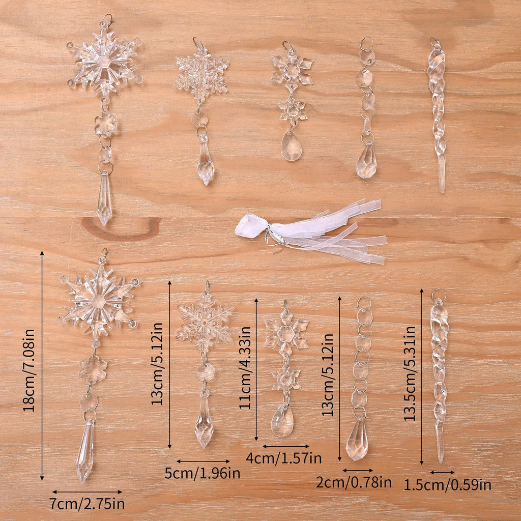 Ten clear transparent acrylic ice cone Christmas tree ornaments with white ribbons on green branches.