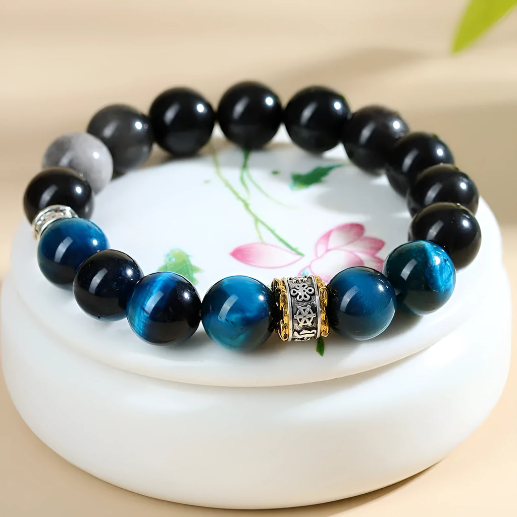 Geometric peacock blue tigereye bracelet with round elements on wrist