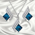 Glass pendant necklace with alloy cross chain and matching electroplated ear studs jewellery set
