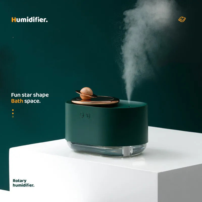 Rotating planet-shaped USB humidifier with night light in green, pink, or white colours.