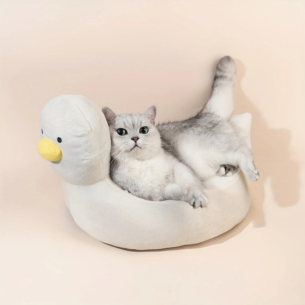 Blue duck-shaped fluffy pet bed sofa for a small dog, showing raised sides and soft material.