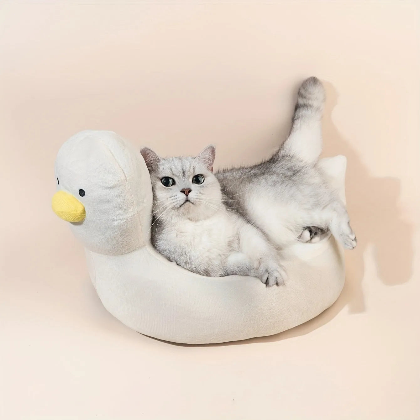 Blue duck-shaped fluffy pet bed sofa for a small dog, showing raised sides and soft material.