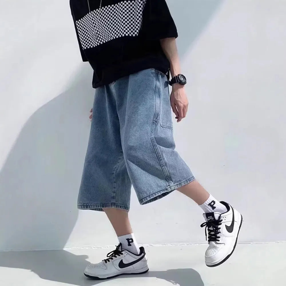 Blue men's thin denim pirate shorts with high waist and cropped straight legs on a neutral background.
