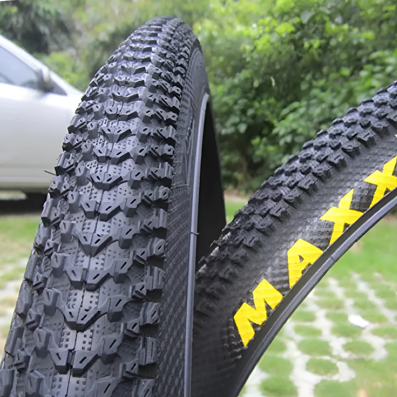 Ultralight puncture-proof mountain bike tyre showing tread pattern and sidewall in available sizes