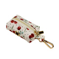 Red cherry print dog collar set with matching leash, vest, and light gold buckle