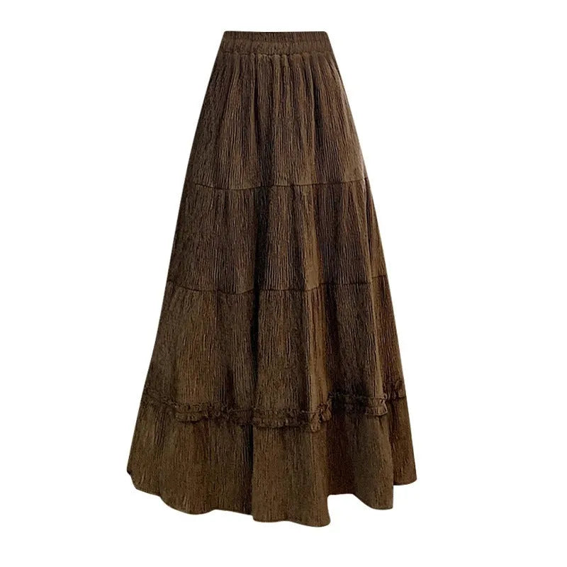 Women's beige corduroy A-line midi skirt with an elasticated waistband on a hanger.