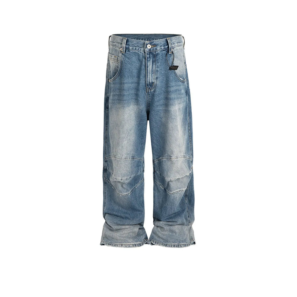 Men's light blue baggy jeans with front pleats and a straight-leg fit on a plain background.