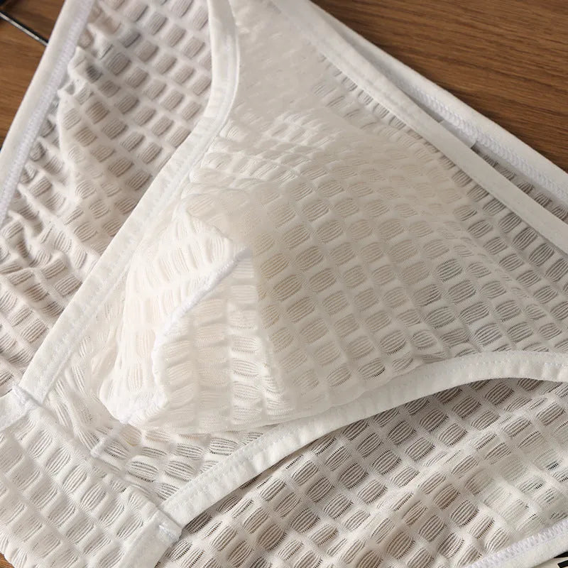 Men's low waist transparent lace underwear shorts in black, green, light purple, rose red, and white colours.
