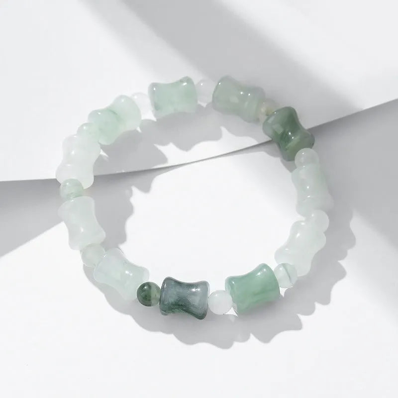 Korean style beaded bracelet with diamond shaped chalcedony and coconut shell beads on an elastic cord.