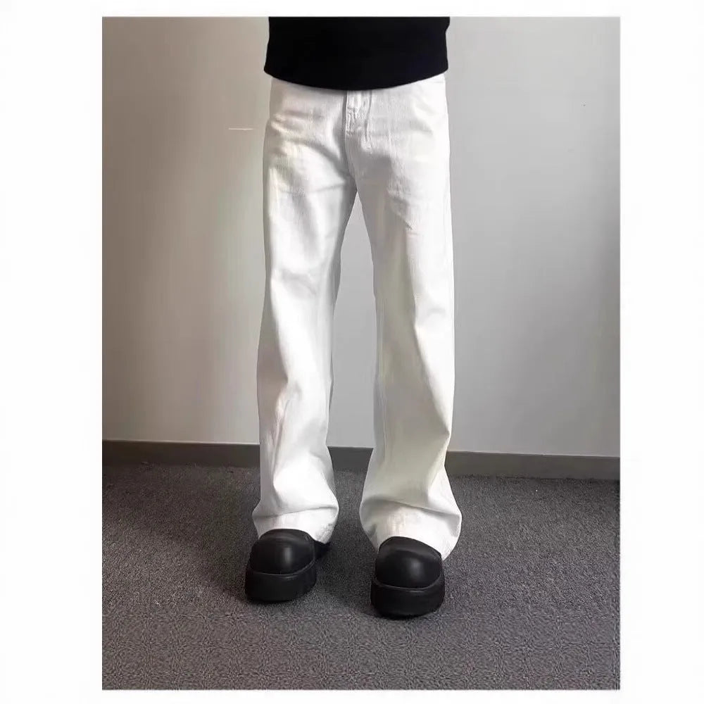 Men's white straight-leg cotton denim jeans on a neutral background.