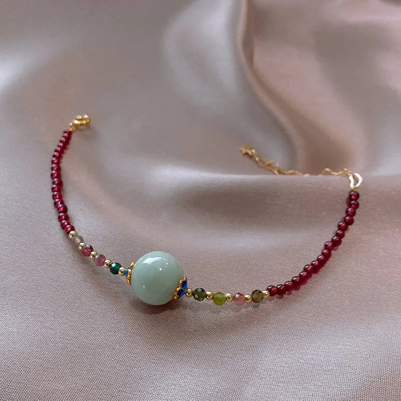 Aquamarine Chinese style garnet coloured tourmaline bracelet with a drop shape.