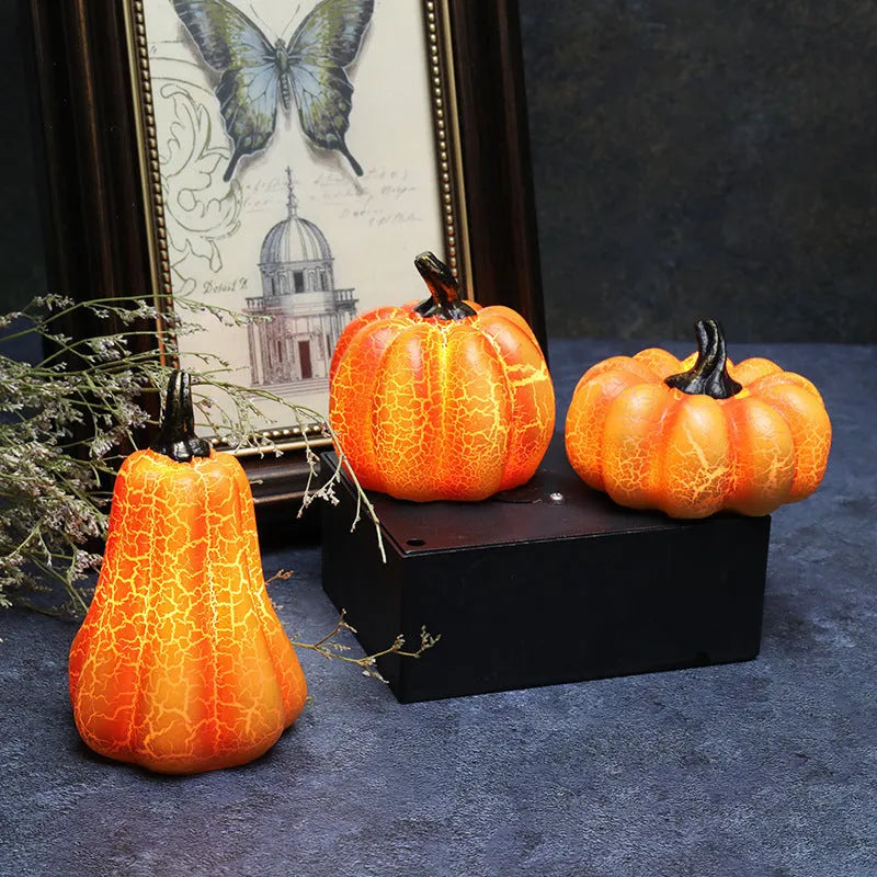 Three Halloween pumpkin lanterns in short, medium, and long sizes with LED illumination and realistic surface cracks