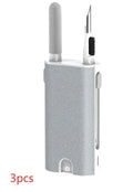 5-in-1 digital cleaning kit with black body, showing flocking sponge, brush, and metal tip for phones and earphones.