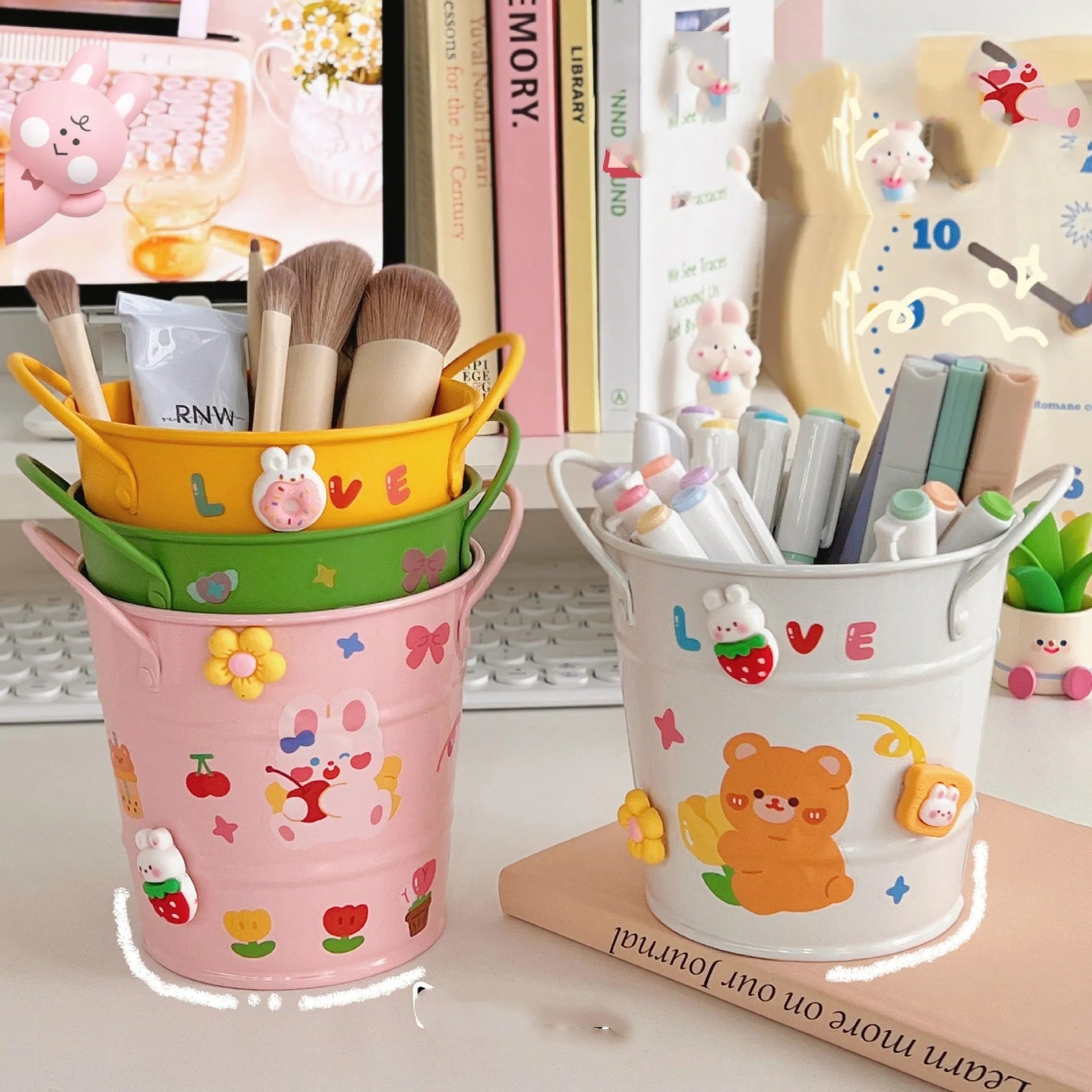 Round creative iron art metal pen holder in assorted colours on a wooden desk.