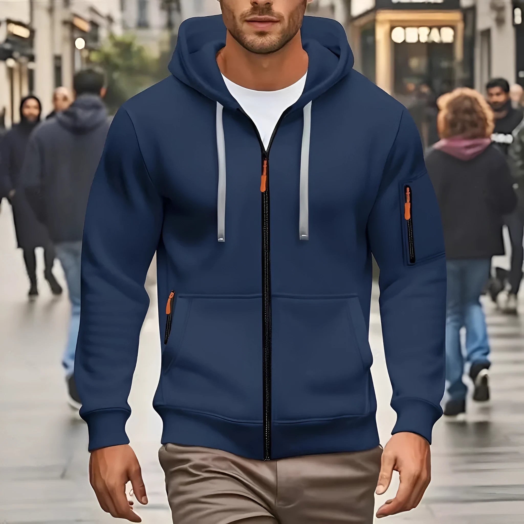 Man wearing a camel-coloured zip-up hooded cardigan coat with a wool lining.