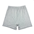 Man wearing solid colour high waist modal boxer shorts in a neutral shade.