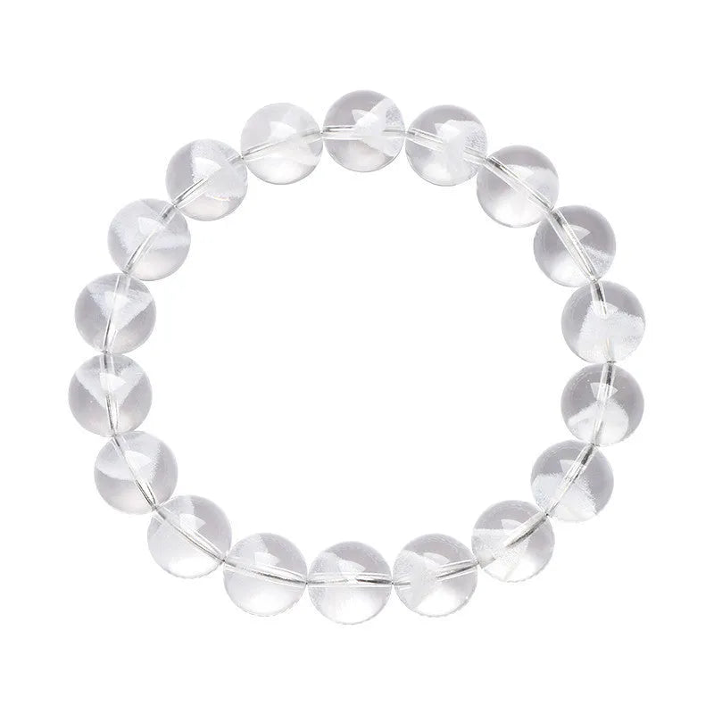 Women's white crystal pyramid bead ghost bracelet with a Ruyi charm on a white background.