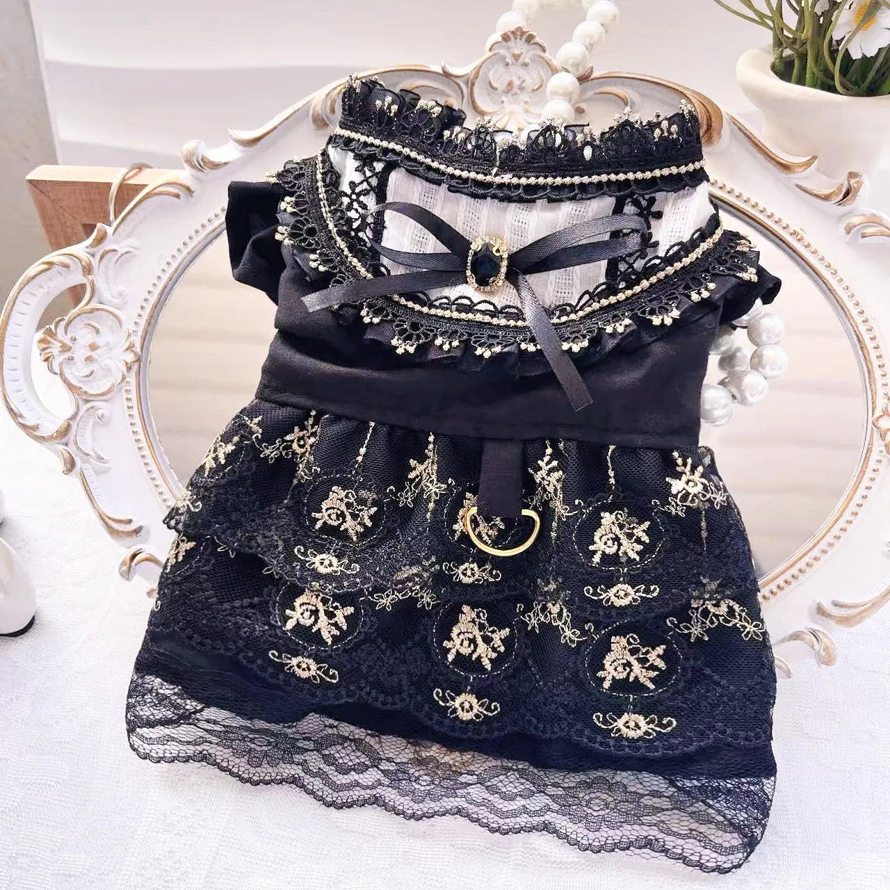 Golden Gothic princess-style skirt pet clothing for a small dog or cat on a mannequin.