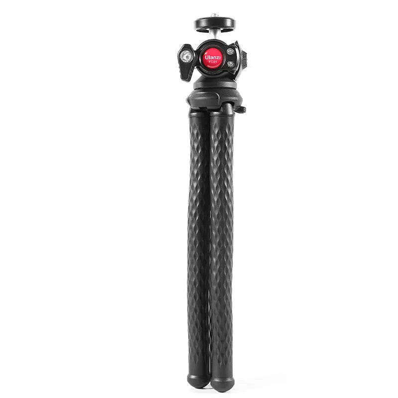 Black octopus-style mobile phone tripod with clip extended to 360mm on a table.
