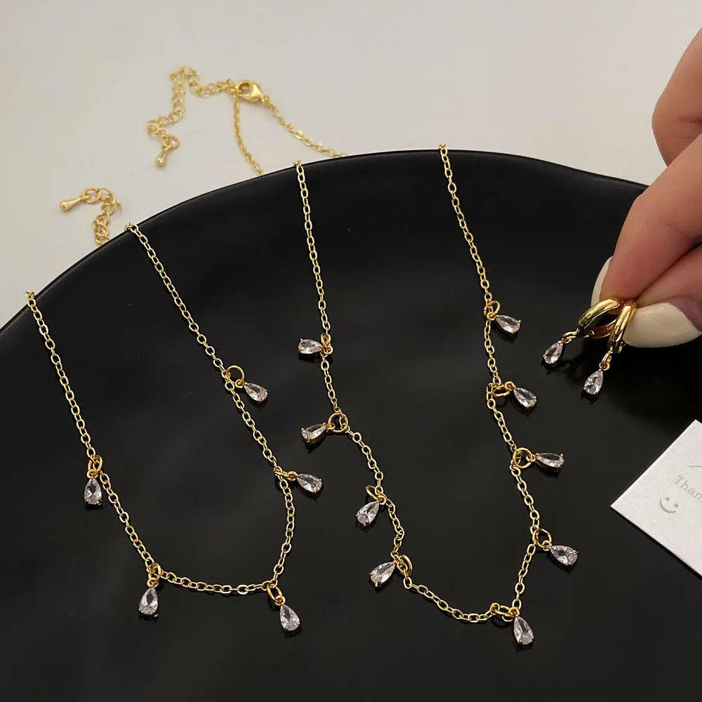 Zircon jewellery set showing necklace, earrings and anklet with geometric Korean-style design