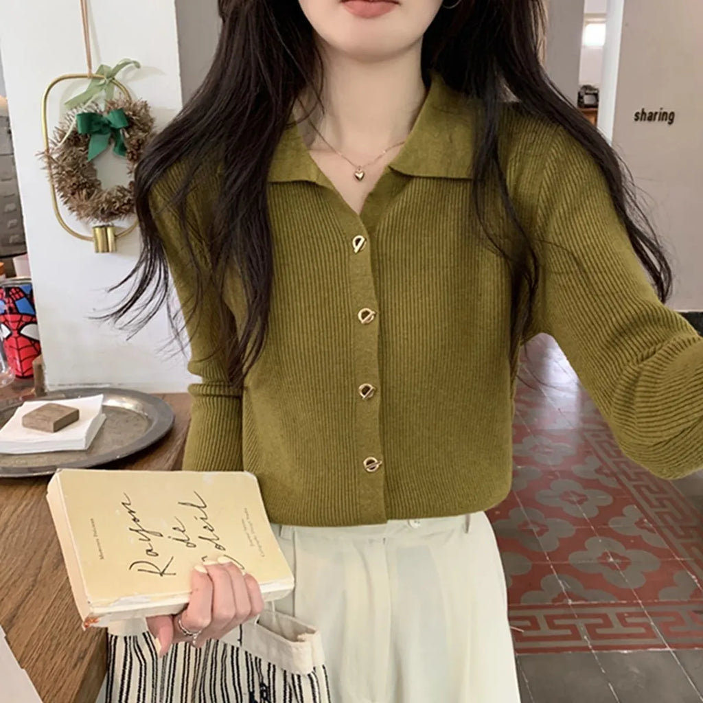 Long-sleeved loose-fitting viscose cardigan top in beige, shown worn open over a top