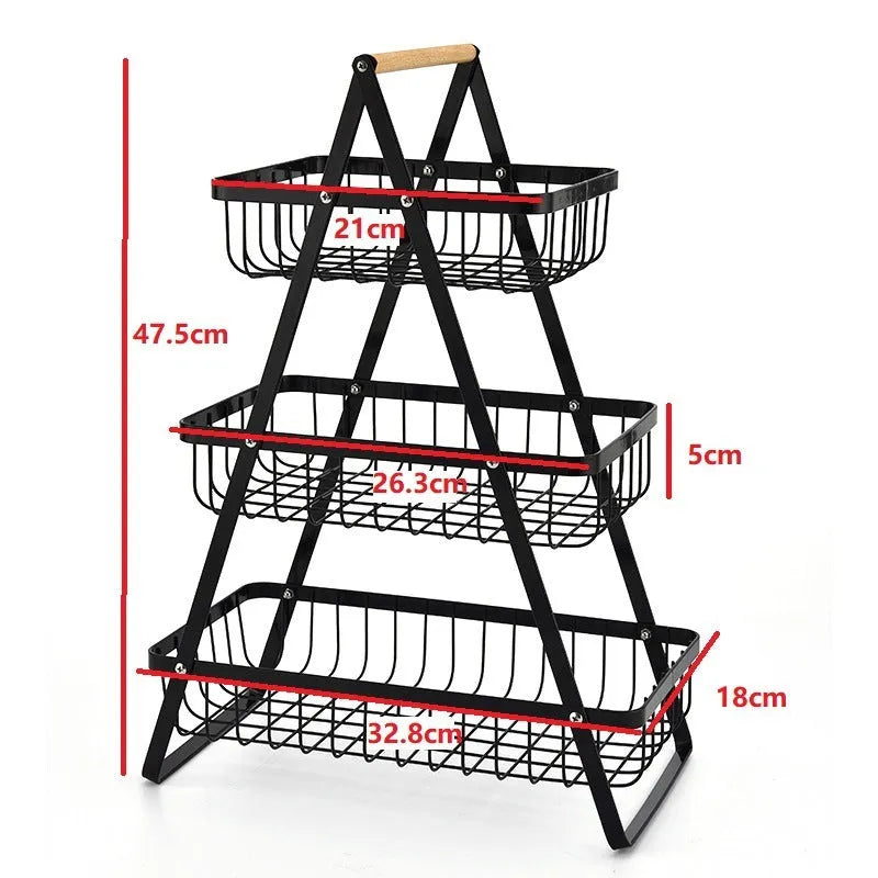 Black detachable double-layer iron fruit basket with a wooden carry handle on a tabletop.