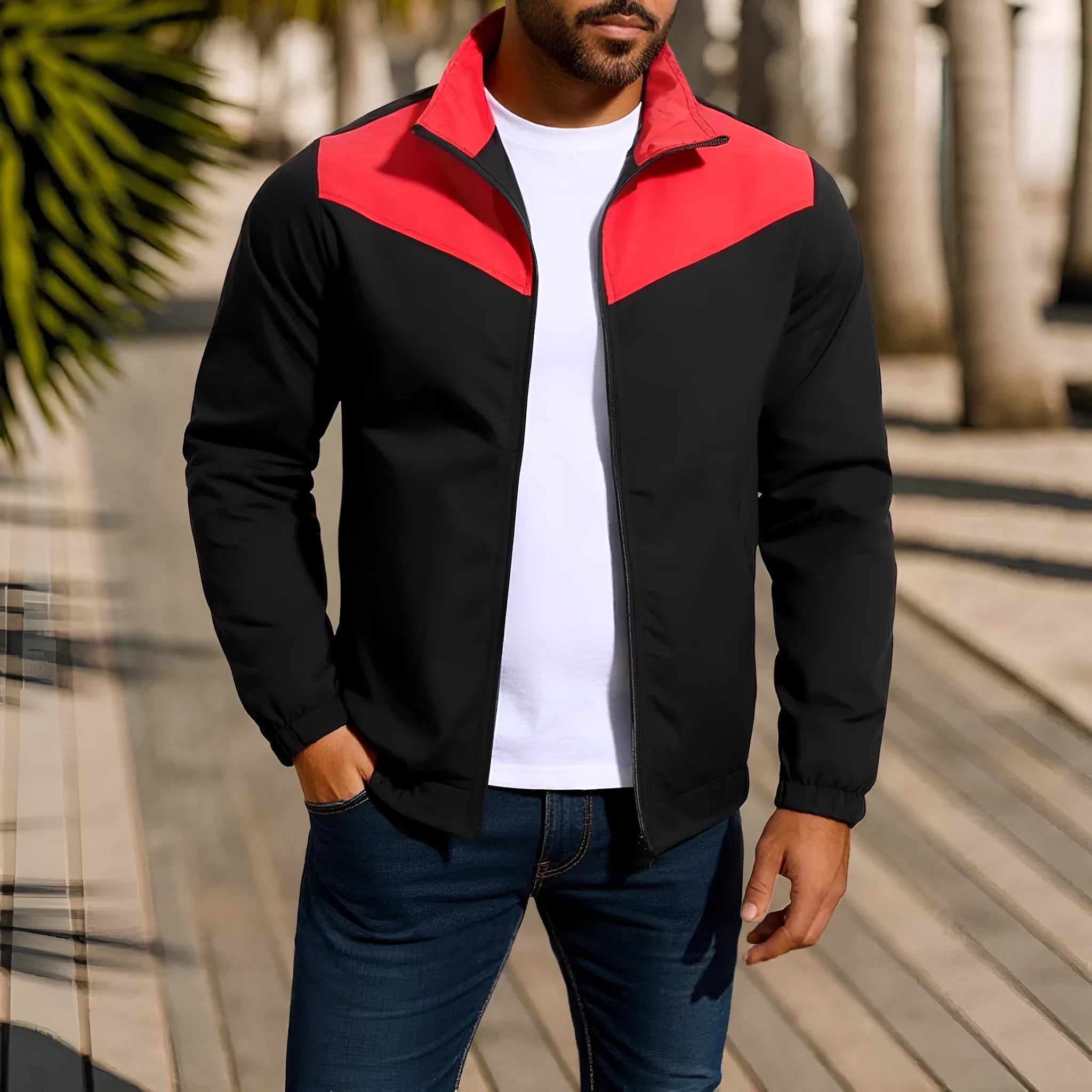 Man wearing a green polyester windproof jacket with a high collar and colour-matched zipper.