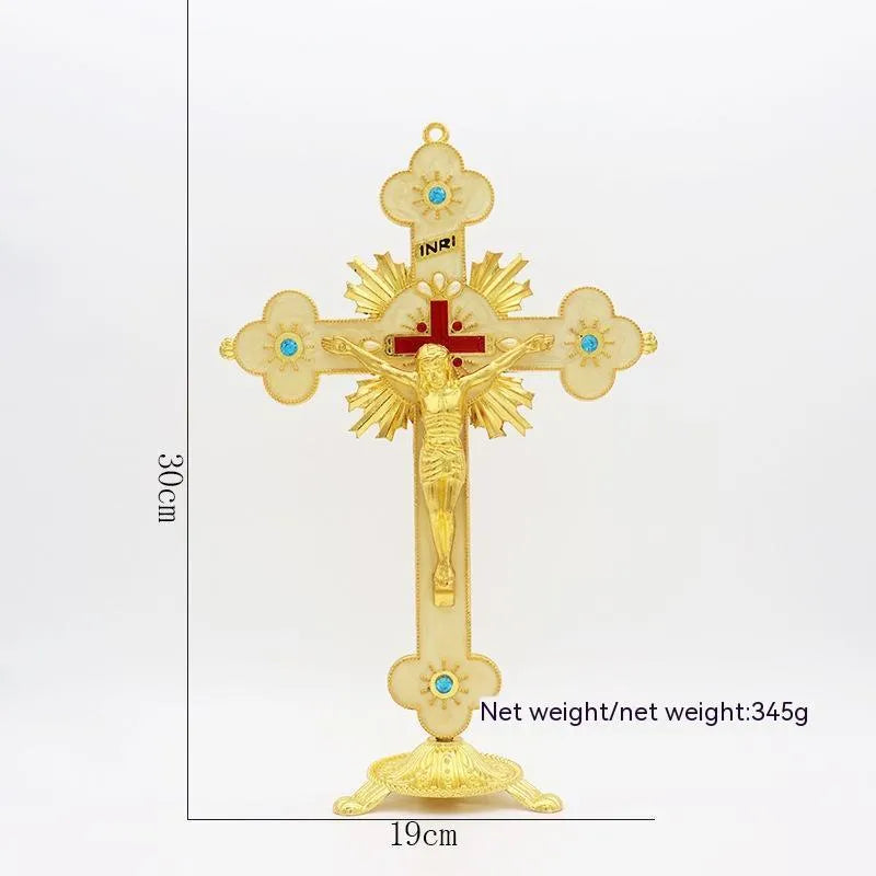 Gold geometric zinc alloy car ornament with micro-inlaid design on a desktop.