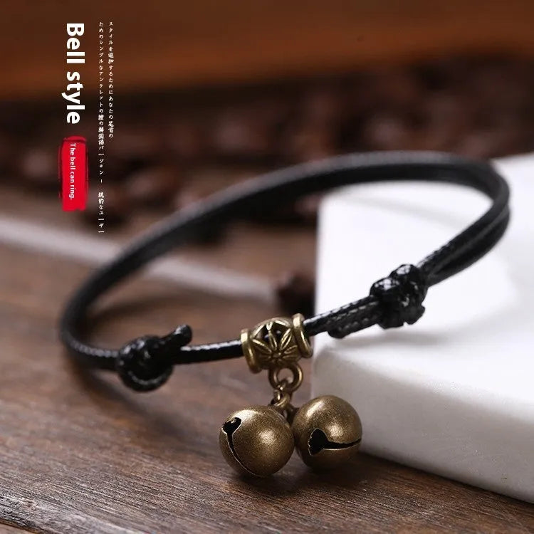Nylon rope dog collar with brass bell, shown in black, red, and coffee colour options.