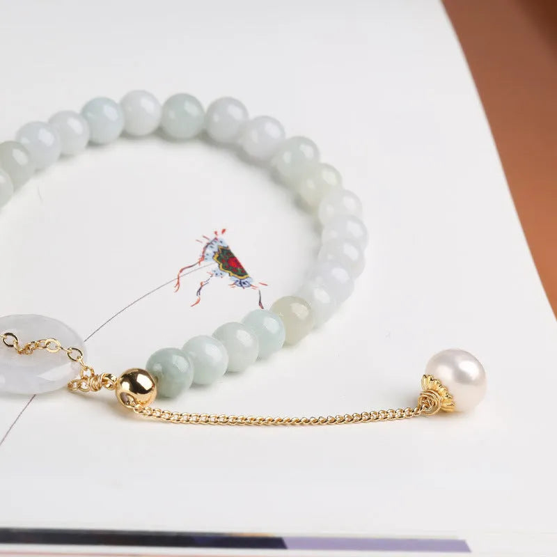 Natural emerald jade pearl bracelet with peace symbol buckle showing geometric charm arrangement