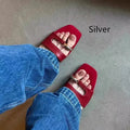 Plus size leather outdoor slippers with square toe in red, white, black, and silver on a rubber sole.