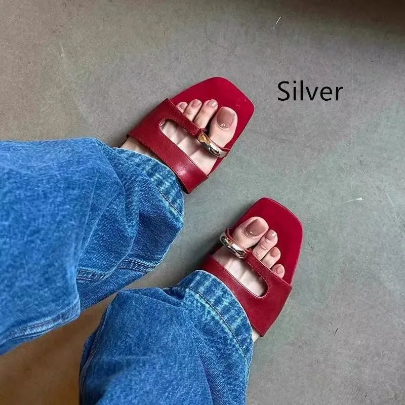 Plus size leather outdoor slippers with square toe in red, white, black, and silver on a rubber sole.