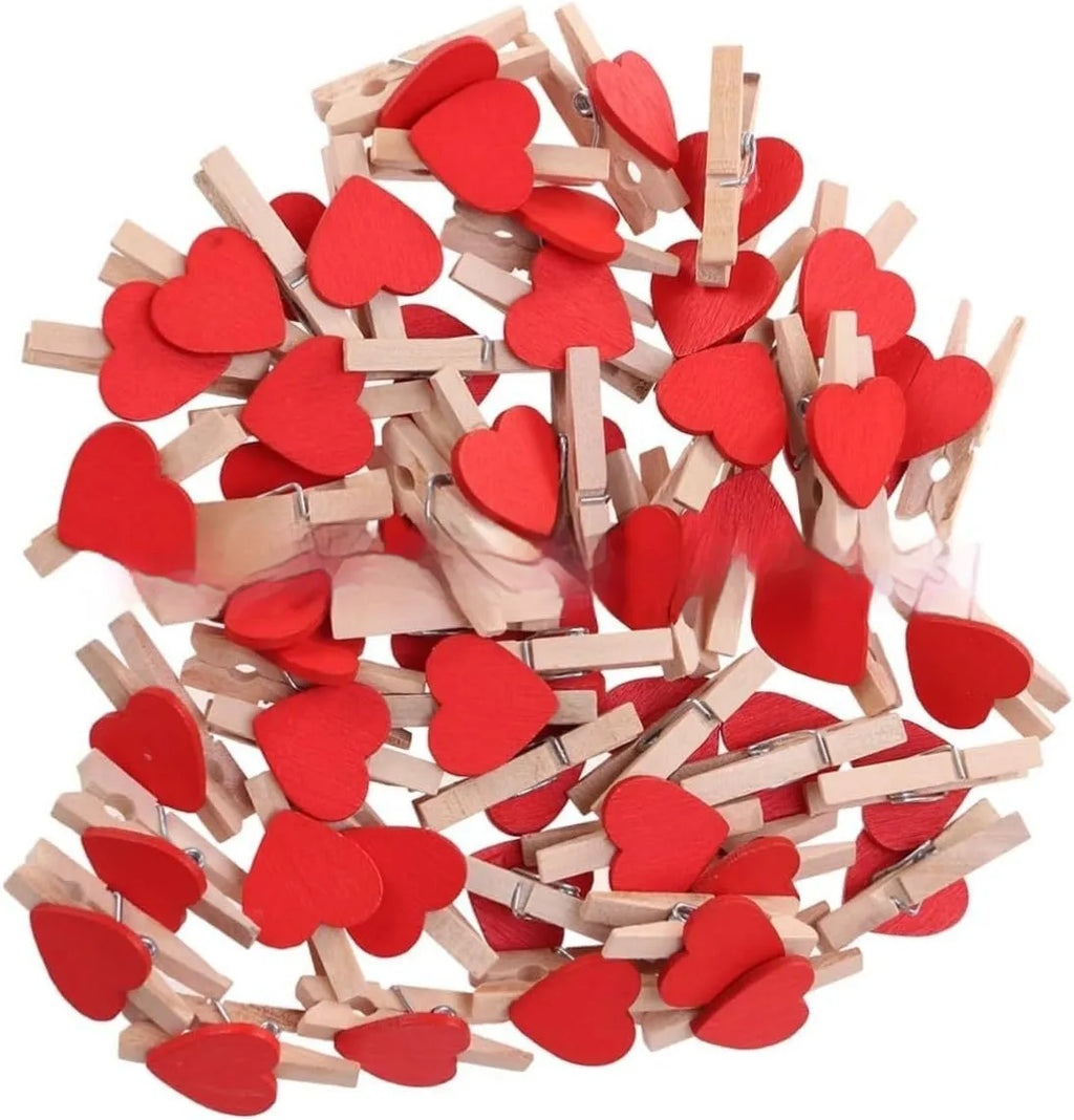 Set of five handmade solid wood heart-shaped clips in red, white, yellow, pink, and rose red.