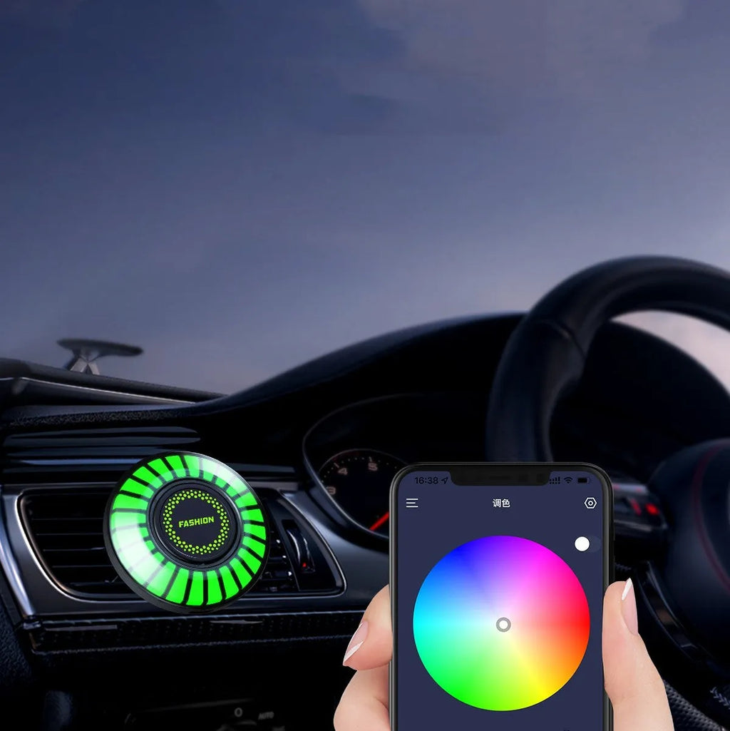 Car air vent mounted RGB atmosphere light with voice control and aromatherapy pod.