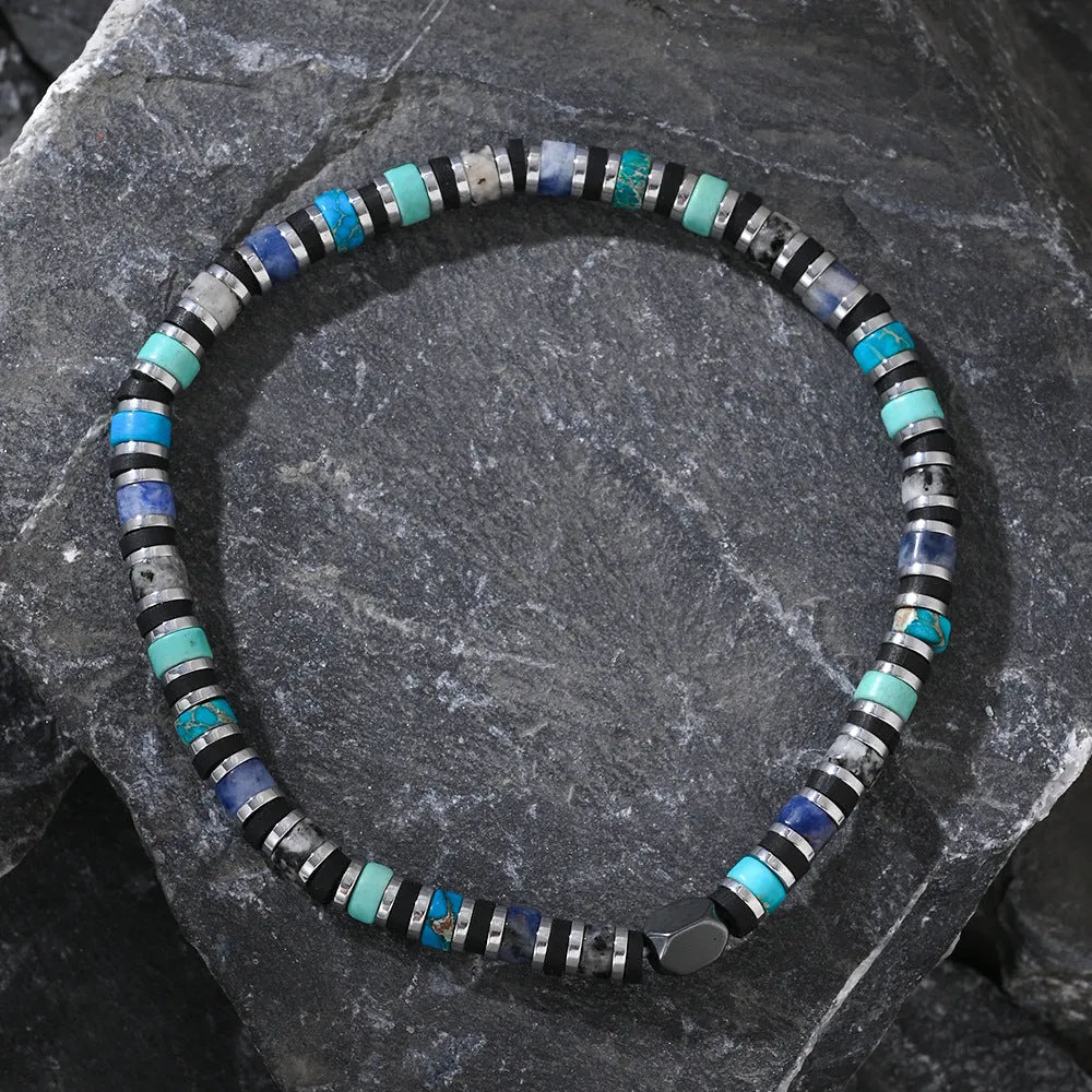 Hand-woven bohemian bracelet with semi-precious stones in geometric cylindrical bead design